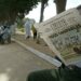 An Algerian reads the 26 May 2003 "Liberte" newspaper titled " All guilty" 26 May 2003, at the entrance of El Alia cemetery in Algiers. The Algerian government scrambled Monday to dispel criticiem it has dragged its heels in helping victims of last week's deadly quake, as Islamic radicals took advantage of the widespread anger towards the authorities and stepped in to fill the void. AFP PHOTO/PHILIPPE DESMAZES (Photo by PHILIPPE DESMAZES / AFP)