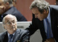 FILE - FIFA President Sepp Blatter, left, and UEFA President Michel Platini are engaged in conversation during the 65th FIFA Congress held at the Hallenstadion in Zurich, Switzerland, on Friday, May 29, 2015. Swiss prosecutors have charged former FIFA officials Sepp Blatter and Michel Platini with fraud and other offenses. (Walter Bieri/Keystone via AP)