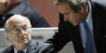 FILE - FIFA President Sepp Blatter, left, and UEFA President Michel Platini are engaged in conversation during the 65th FIFA Congress held at the Hallenstadion in Zurich, Switzerland, on Friday, May 29, 2015. Swiss prosecutors have charged former FIFA officials Sepp Blatter and Michel Platini with fraud and other offenses. (Walter Bieri/Keystone via AP)