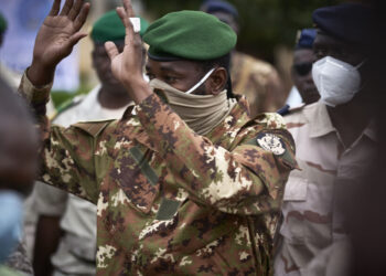 Colonel Assimi Goita, president of the CNSP (National Committee for the Salvation of the People), gestures as he arrives at the funeral of former Mali President General Moussa Traore in Bamako on September 18, 2020. - Mali held a state funeral for former Mali president Moussa Traore on September 18, 2020, attended by the head of the ruling military junta and other former leaders of the Sahel state, according to AFP journalists.
Traore, who ruled Mali for 22 years before being deposed in a 1991 coup, died at age 83 in the capital Bamako on September 15, 2020. (Photo by MICHELE CATTANI / AFP)