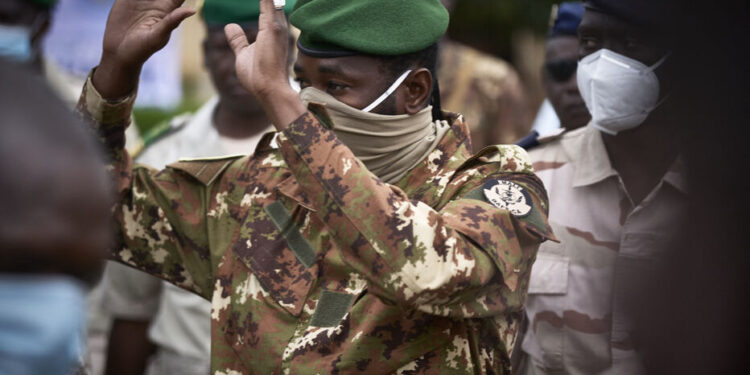 Colonel Assimi Goita, president of the CNSP (National Committee for the Salvation of the People), gestures as he arrives at the funeral of former Mali President General Moussa Traore in Bamako on September 18, 2020. - Mali held a state funeral for former Mali president Moussa Traore on September 18, 2020, attended by the head of the ruling military junta and other former leaders of the Sahel state, according to AFP journalists.
Traore, who ruled Mali for 22 years before being deposed in a 1991 coup, died at age 83 in the capital Bamako on September 15, 2020. (Photo by MICHELE CATTANI / AFP)