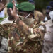 Colonel Assimi Goita, president of the CNSP (National Committee for the Salvation of the People), gestures as he arrives at the funeral of former Mali President General Moussa Traore in Bamako on September 18, 2020. - Mali held a state funeral for former Mali president Moussa Traore on September 18, 2020, attended by the head of the ruling military junta and other former leaders of the Sahel state, according to AFP journalists.
Traore, who ruled Mali for 22 years before being deposed in a 1991 coup, died at age 83 in the capital Bamako on September 15, 2020. (Photo by MICHELE CATTANI / AFP)