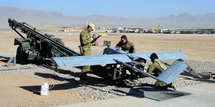 Ground crew prepare a SHADOW 200 Tactical Unmanned Aerial System for launch at Multi National Base Tarin Kot.

Mid Caption: The SHADOW 200 Tactical Unmanned Aerial System will replace the Scan Eagle Unmanned Aerial Vehicle providing Intelligence, Surveillance and Reconnaissance support to Australian and International Security Assistance Force operations in Uruzgan from April.

The SHADOW 200 carries a suite of sensors, including high resolution cameras and laser systems. 

Ground troops are able to view footage and data from the aircraft in real-time on ground terminals. 

The SHADOW 200 system provides the Australian Army with a capable and operationally proven mobile Tactical Unmanned Aerial System.

Photo by Sergeant Mick Davis
1st Joint Public Affairs Unit