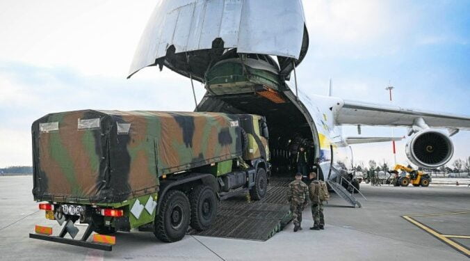 Military equipment of the French army is downloaded from an Antonov 124 freight airplane, at Mihail Kogalniceanu Air Base near Constanta, Romania, on March 3, 2022.  The french military landed on March 3, 2022 at the Mihail Kogalniceanu military base near Constanta, on the shores of the Black Sea to fit into the system of around 500 soldiers that France is deploying urgently within the framework of NATO after the Russia's full-scale invasion in Ukraine just a week ago. (Photo by Daniel MIHAILESCU / AFP)