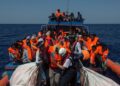 Migrants are rescued by members of the Aquarius rescue ship run by non-governmental organisations (NGO) "SOS Mediterranee" and "Medecins Sans Frontieres" (Doctors Without Borders) in the Mediterranean Sea, 30 nautic miles from the Libyan coast, on August 2, 2017. Italy on August 2, 2017 began enforcing a controversial code of conduct for charity boats rescuing migrants in the Mediterranean as new figures revealed a sharp drop in the numbers of people arriving from Libya. / AFP PHOTO / Angelos Tzortzinis ITALY-LIBYA-EUROPE-MIGRANTS-NGO