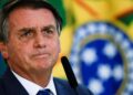 Brazil's President Jair Bolsonaro looks on during the launch ceremony of the National Identity Card at the Planalto Palace in Brasilia, Brazil February 23, 2022. REUTERS/Ueslei Marcelino