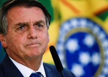 Brazil's President Jair Bolsonaro looks on during the launch ceremony of the National Identity Card at the Planalto Palace in Brasilia, Brazil February 23, 2022. REUTERS/Ueslei Marcelino