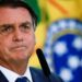 Brazil's President Jair Bolsonaro looks on during the launch ceremony of the National Identity Card at the Planalto Palace in Brasilia, Brazil February 23, 2022. REUTERS/Ueslei Marcelino