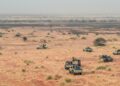 Pick-up trucks belonging to militants of The Movement for the Salvation of Azawad are seen patrolling along the Mali-Niger border in the deserted area of the Menaka region in Mali during an anti jihadist patrol on February 4, 2018. (Photo by Souleymane AG ANARA / AFP)