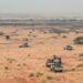 Pick-up trucks belonging to militants of The Movement for the Salvation of Azawad are seen patrolling along the Mali-Niger border in the deserted area of the Menaka region in Mali during an anti jihadist patrol on February 4, 2018. (Photo by Souleymane AG ANARA / AFP)